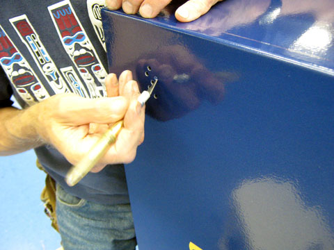 Cutting out the vent holes.